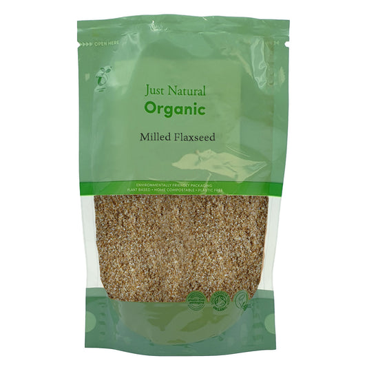 Green package of Just Natural Organic Milled Flaxseed on a white background